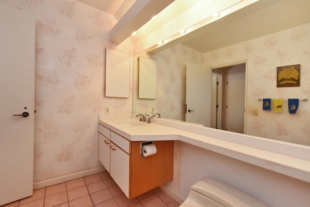 bathroom with vanity, toilet, and tile patterned floors