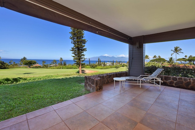 view of patio / terrace featuring a water and mountain view