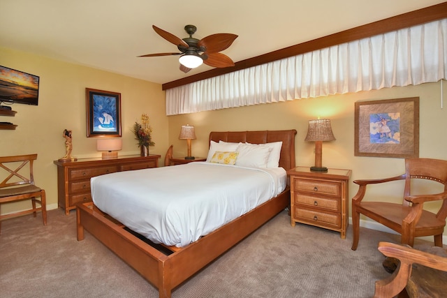 bedroom with ceiling fan and light colored carpet