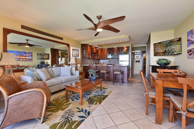 living room with light tile patterned floors and sink