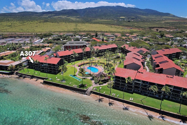 birds eye view of property with a mountain view