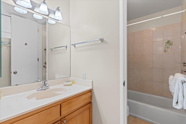 full bathroom with vanity, toilet, and tiled shower / bath