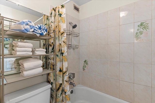 bathroom featuring shower / bathtub combination with curtain