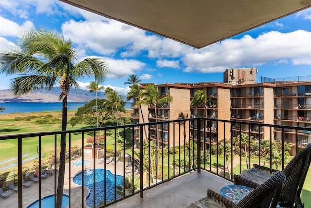 balcony featuring a water view