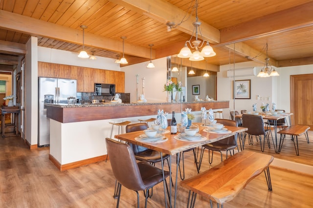 dining area with wood ceiling, beamed ceiling, hardwood / wood-style floors, and an inviting chandelier