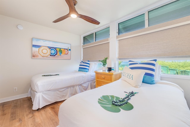 bedroom featuring ceiling fan and hardwood / wood-style flooring