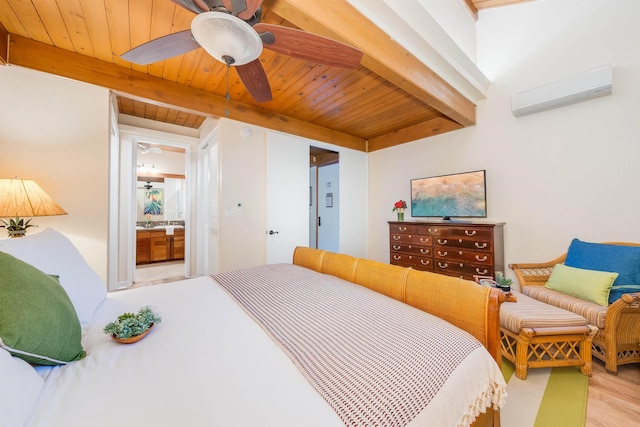 bedroom featuring a wall unit AC, ceiling fan, wooden ceiling, ensuite bathroom, and light hardwood / wood-style flooring