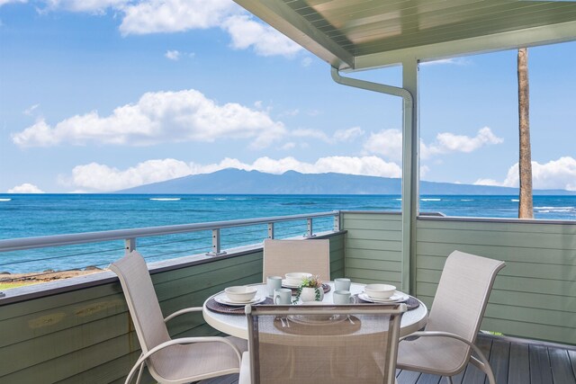 balcony with a water and mountain view