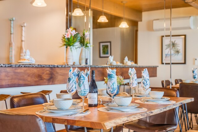 dining room with a wall mounted AC