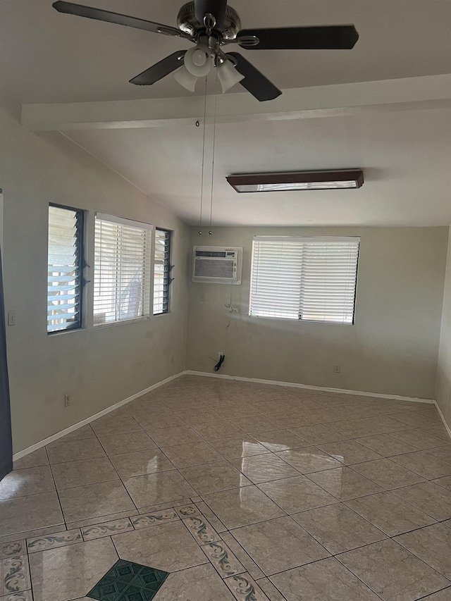 empty room with vaulted ceiling, a ceiling fan, baseboards, and a wall mounted air conditioner