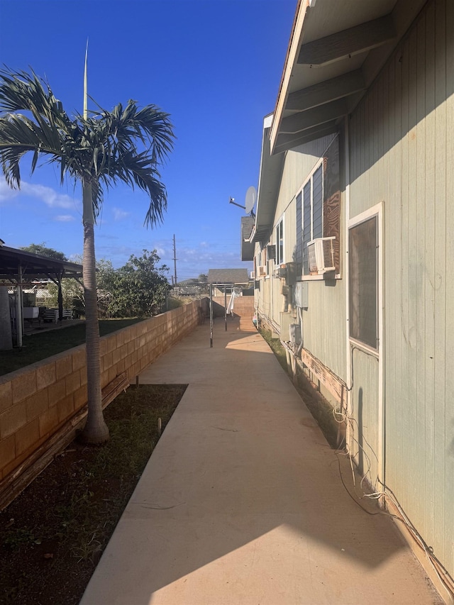 view of home's exterior featuring fence