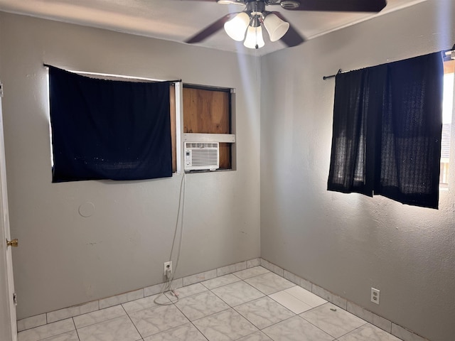 unfurnished room featuring tile patterned floors, cooling unit, and ceiling fan