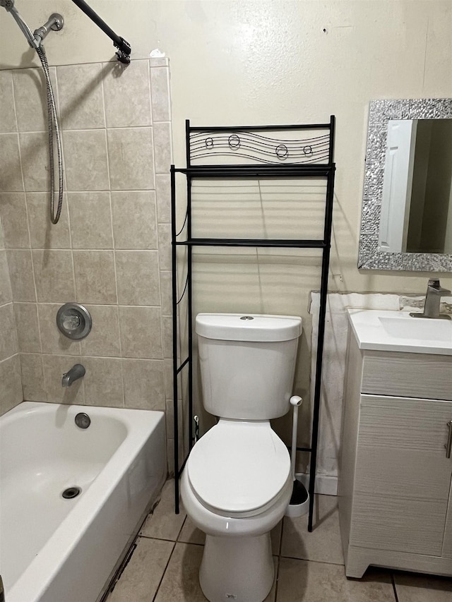 bathroom featuring tile patterned floors, toilet, tub / shower combination, and vanity