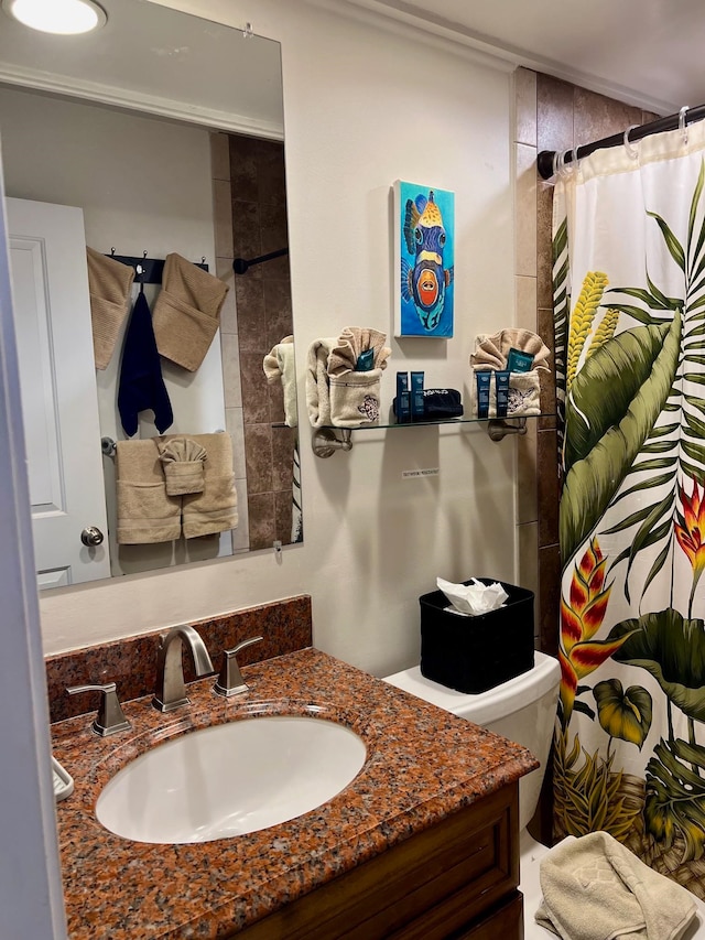 bathroom with vanity and toilet