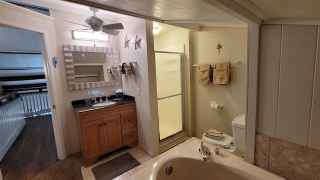 bathroom with walk in shower, ceiling fan, wood-type flooring, vanity, and toilet