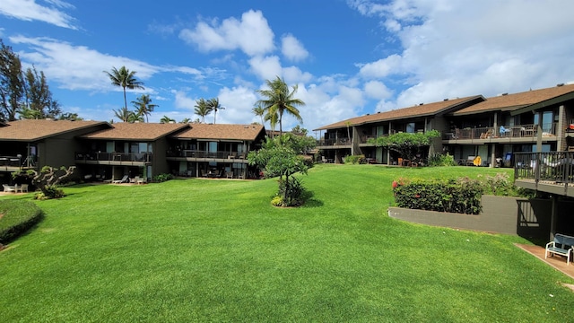 view of yard featuring a balcony