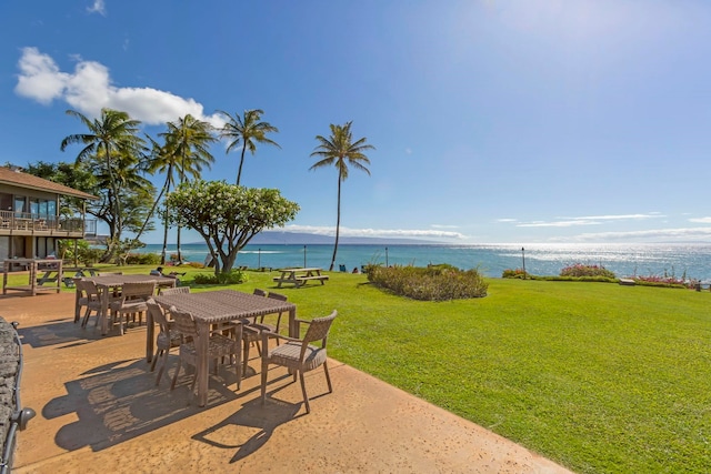 view of patio with a water view