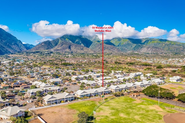 birds eye view of property with a mountain view