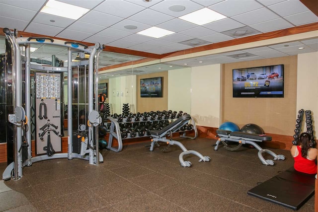 workout area with a paneled ceiling