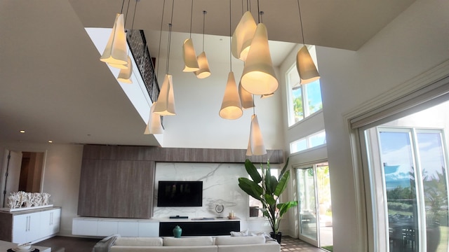 living area with a high ceiling