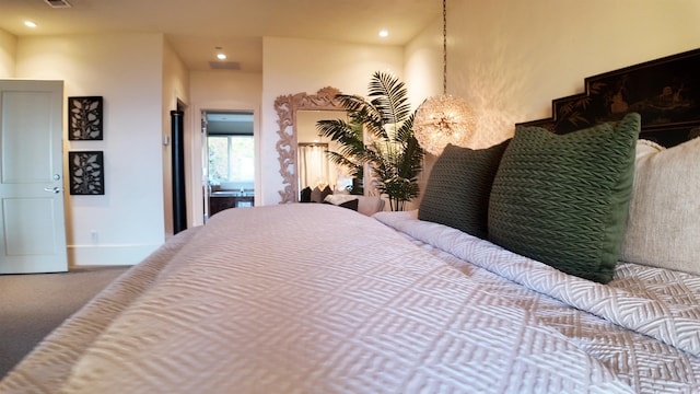 bedroom with a chandelier, recessed lighting, carpet flooring, and baseboards