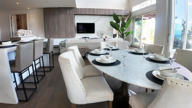 dining space with dark wood-style floors