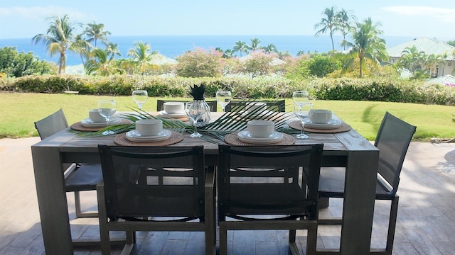 view of patio / terrace featuring outdoor dining area and a water view