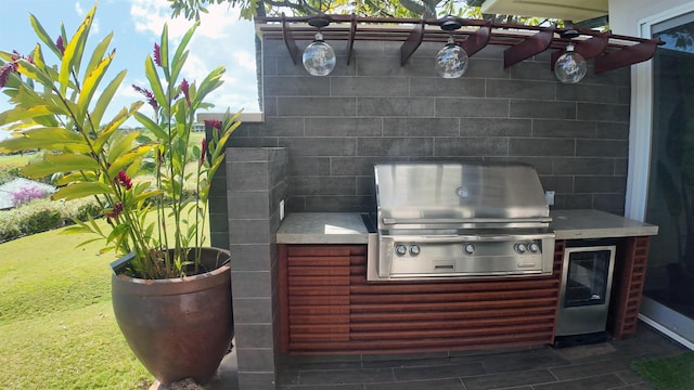 view of patio / terrace featuring an outdoor kitchen and area for grilling