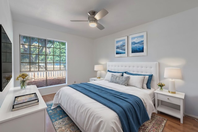 bedroom with ceiling fan and wood-type flooring