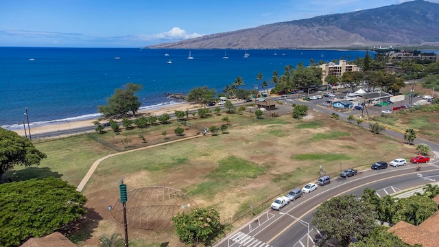 drone / aerial view featuring a water and mountain view