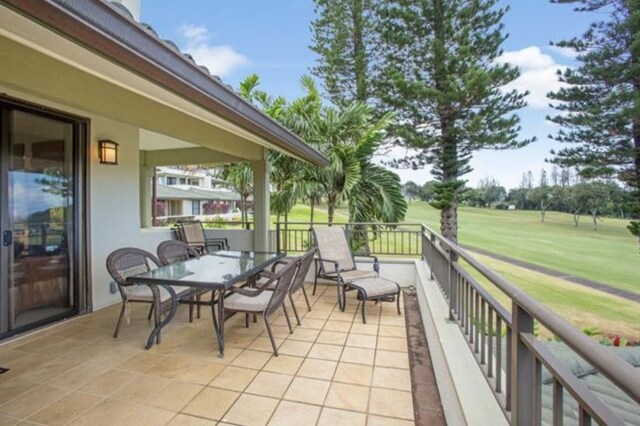 view of patio featuring a balcony