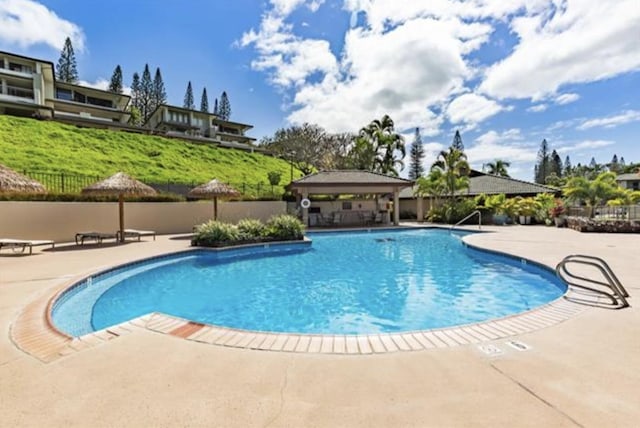 view of pool with a patio area and a gazebo