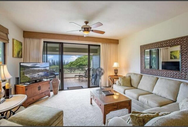 living room with ceiling fan and light carpet