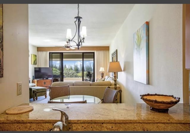 interior space with pendant lighting and an inviting chandelier