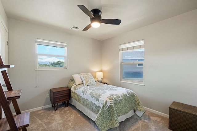 33 Hoku Pl, Paia, HI 96779 - bedroom featuring light colored carpet, baseboards, and a ceiling fan