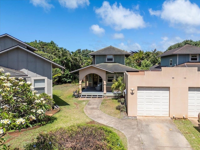 33 Hoku Pl, Paia, HI 96779 - view of front of house featuring covered porch, a front lawn, and driveway