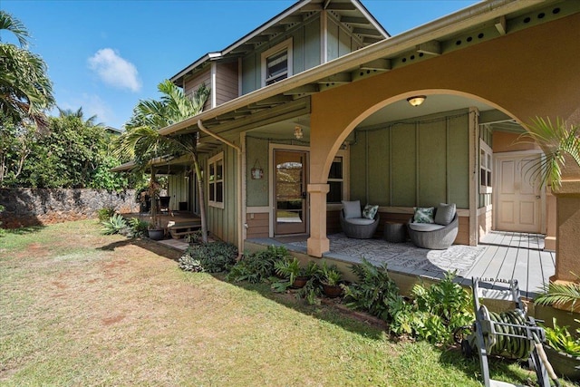 33 Hoku Pl, Paia, HI 96779 - rear view of property featuring board and batten siding, a yard, and a porch