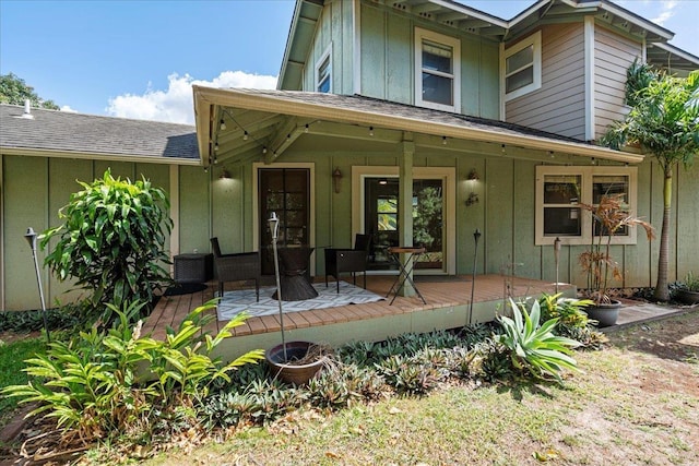 33 Hoku Pl, Paia, HI 96779 - back of house with board and batten siding, cooling unit, and a deck