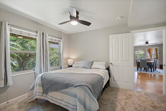 33 Hoku Pl, Paia, HI 96779 - carpeted bedroom with multiple windows, baseboards, and ceiling fan
