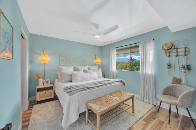 bedroom featuring ceiling fan and light hardwood / wood-style flooring