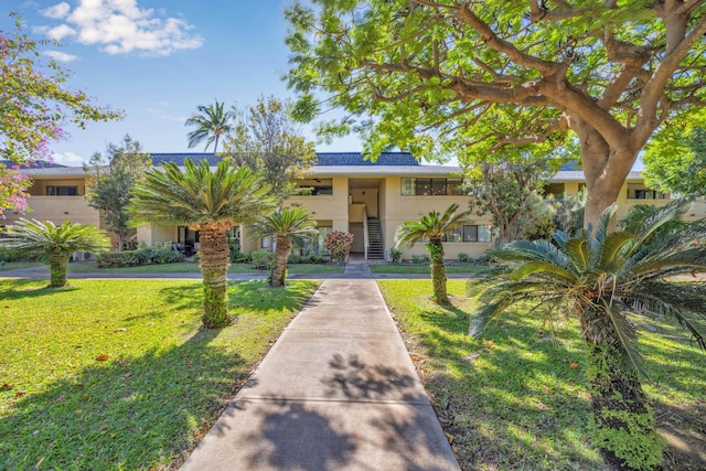 view of front of property with a front lawn