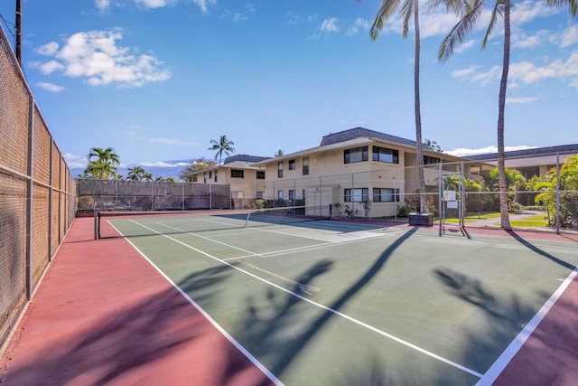 view of tennis court featuring basketball hoop