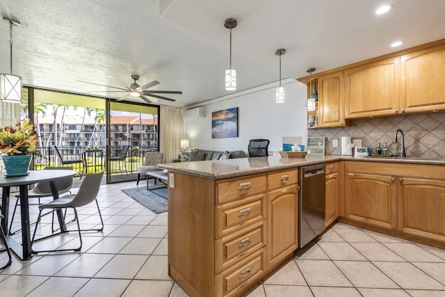 kitchen featuring tasteful backsplash, pendant lighting, stainless steel dishwasher, and kitchen peninsula