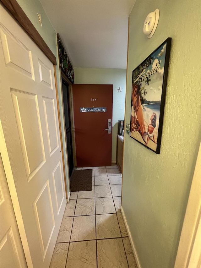 715 S Kihei Rd Unit D144, Kihei, HI 96753 - hallway featuring light marble finish flooring