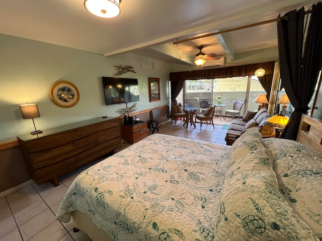 bedroom with beamed ceiling and light tile patterned floors