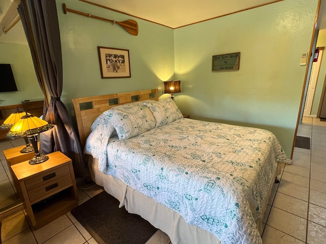 bedroom with light tile patterned flooring