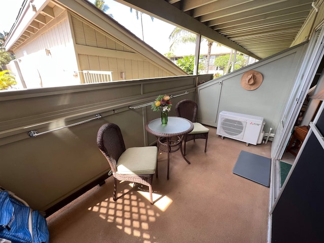 balcony with ac unit and a patio area