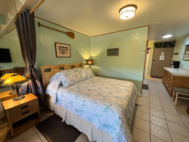 bedroom with light tile patterned floors