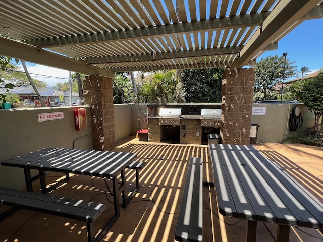 715 S Kihei Rd Unit D144, Kihei, HI 96753 - view of patio / terrace with exterior kitchen, a pergola, outdoor dining area, and grilling area