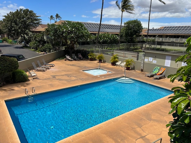 view of swimming pool with a community hot tub and a patio